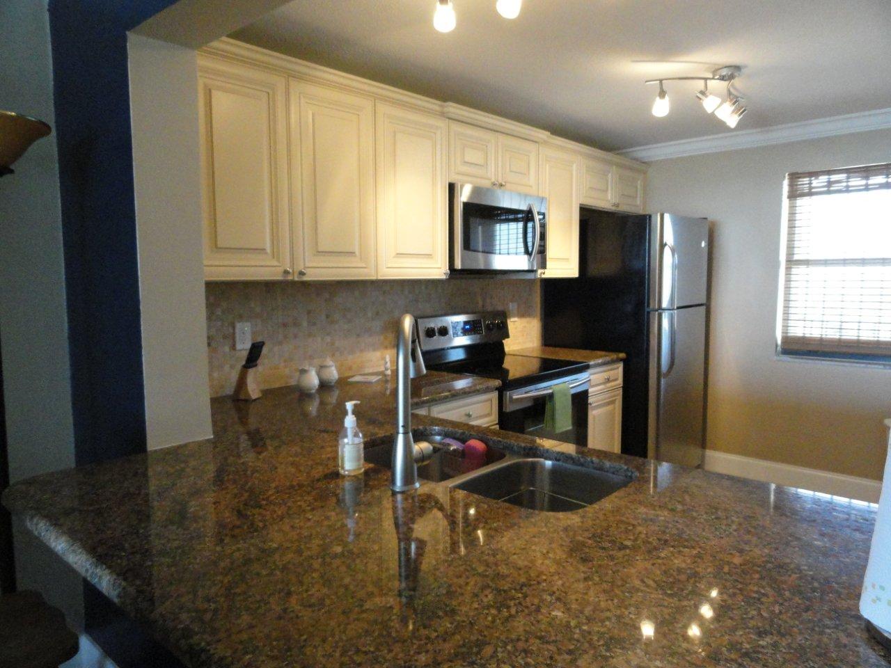 Newly renovated kitchen, all stainless steel appliances, and granite countertops